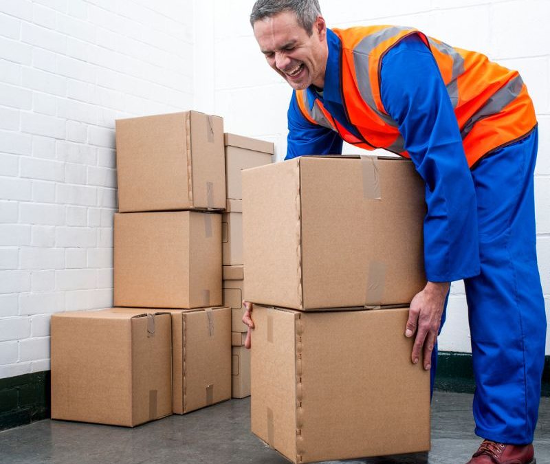 Man injured lifting heavy boxes - workers' comp in North Carolina - our new legal guide