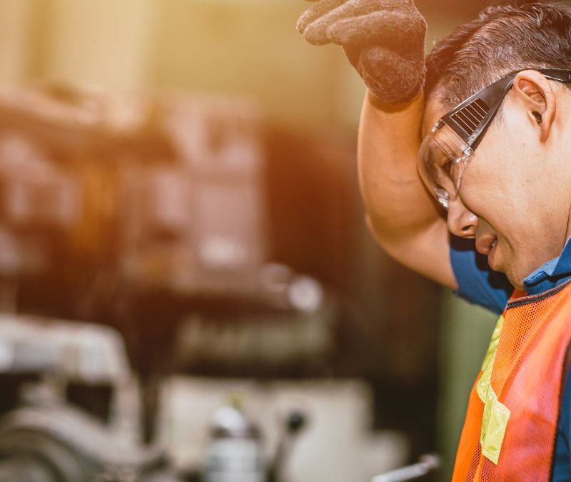 Man working in high heat conditions - too hot to work, unsafe temperatures and workplace heat exposure